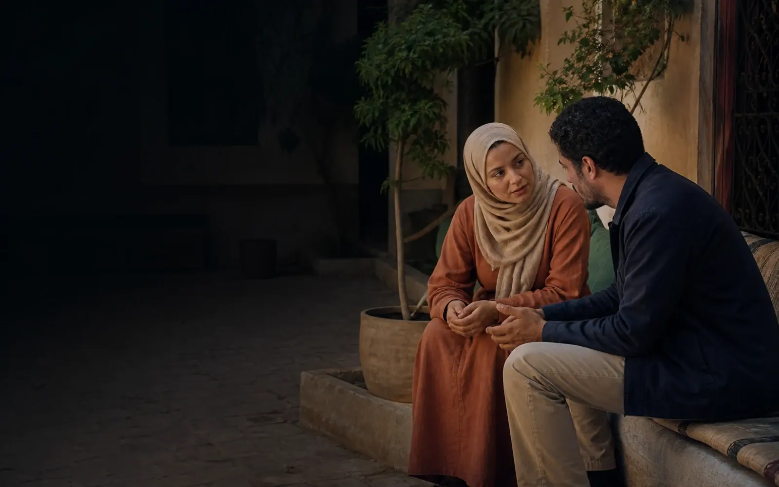 Two community members in a calm, supportive conversation